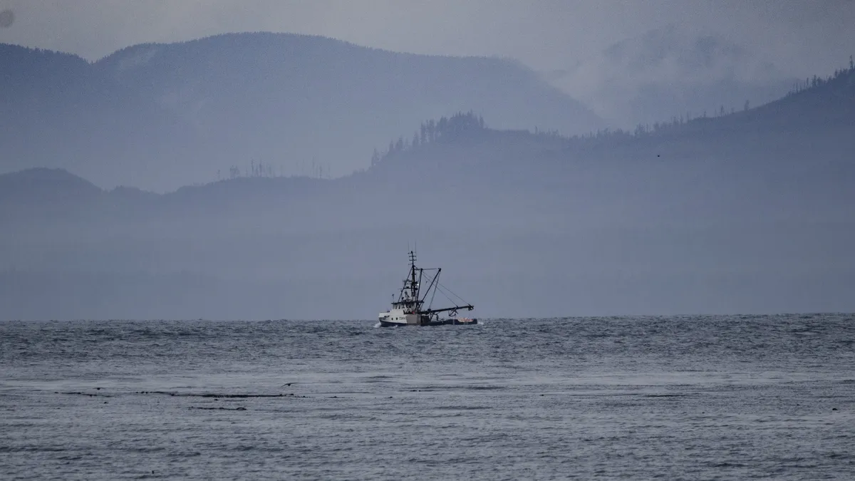 A fishing boat in the fog
